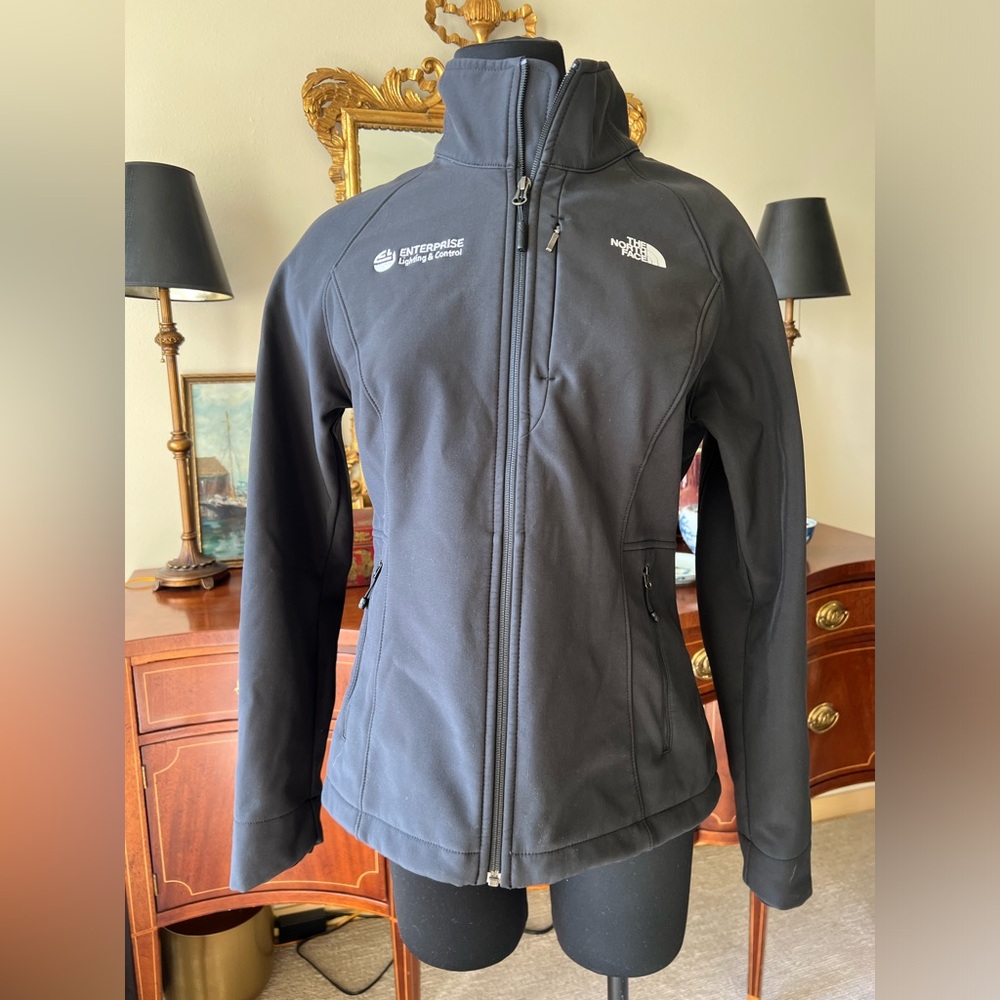 The North Face jacket with company branding Size M runs small